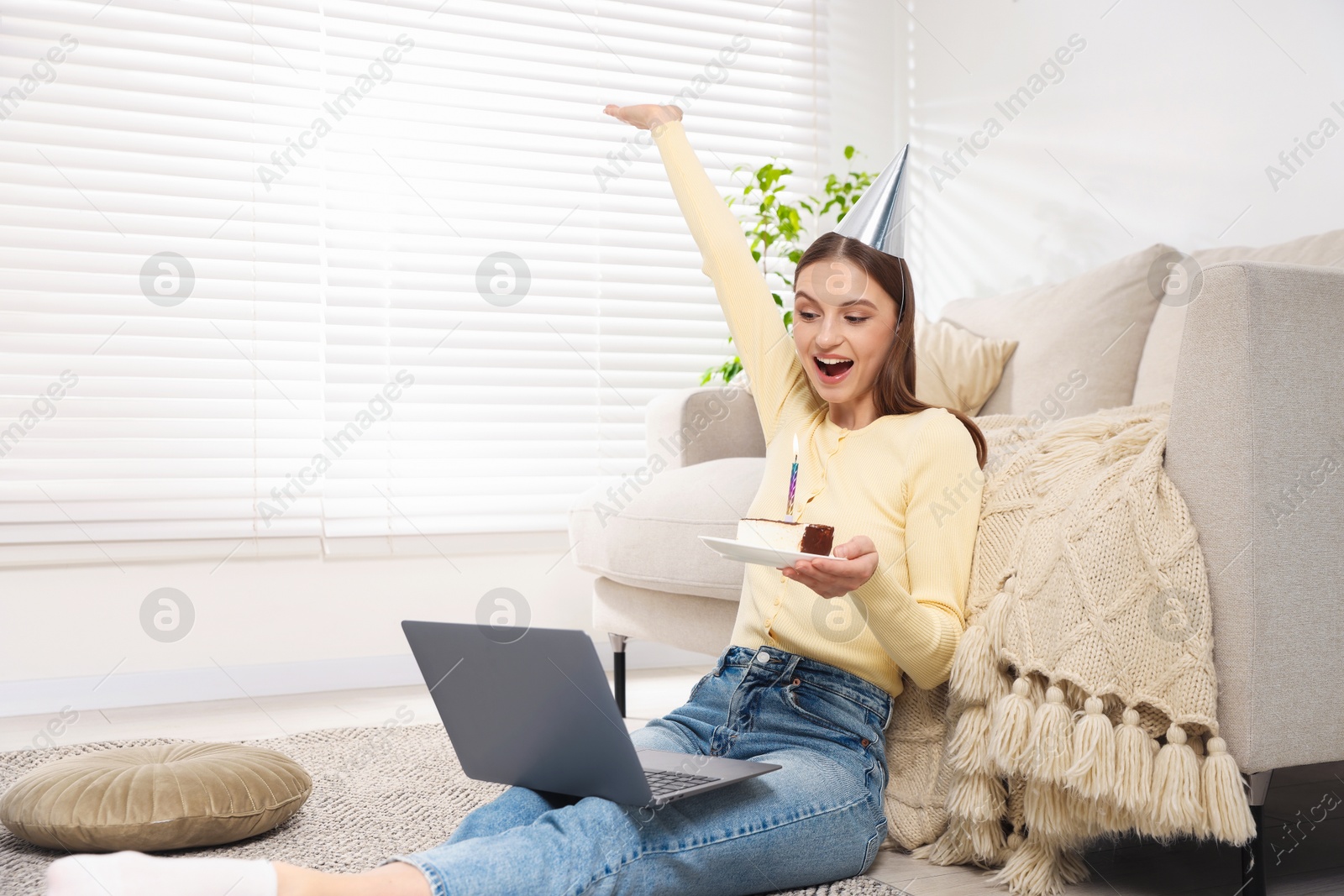 Birthday celebration. Happy woman with piece of cake having video call via laptop at home Photo of Birthday celebration. Happy woman with piece of cake having video call via laptop at home