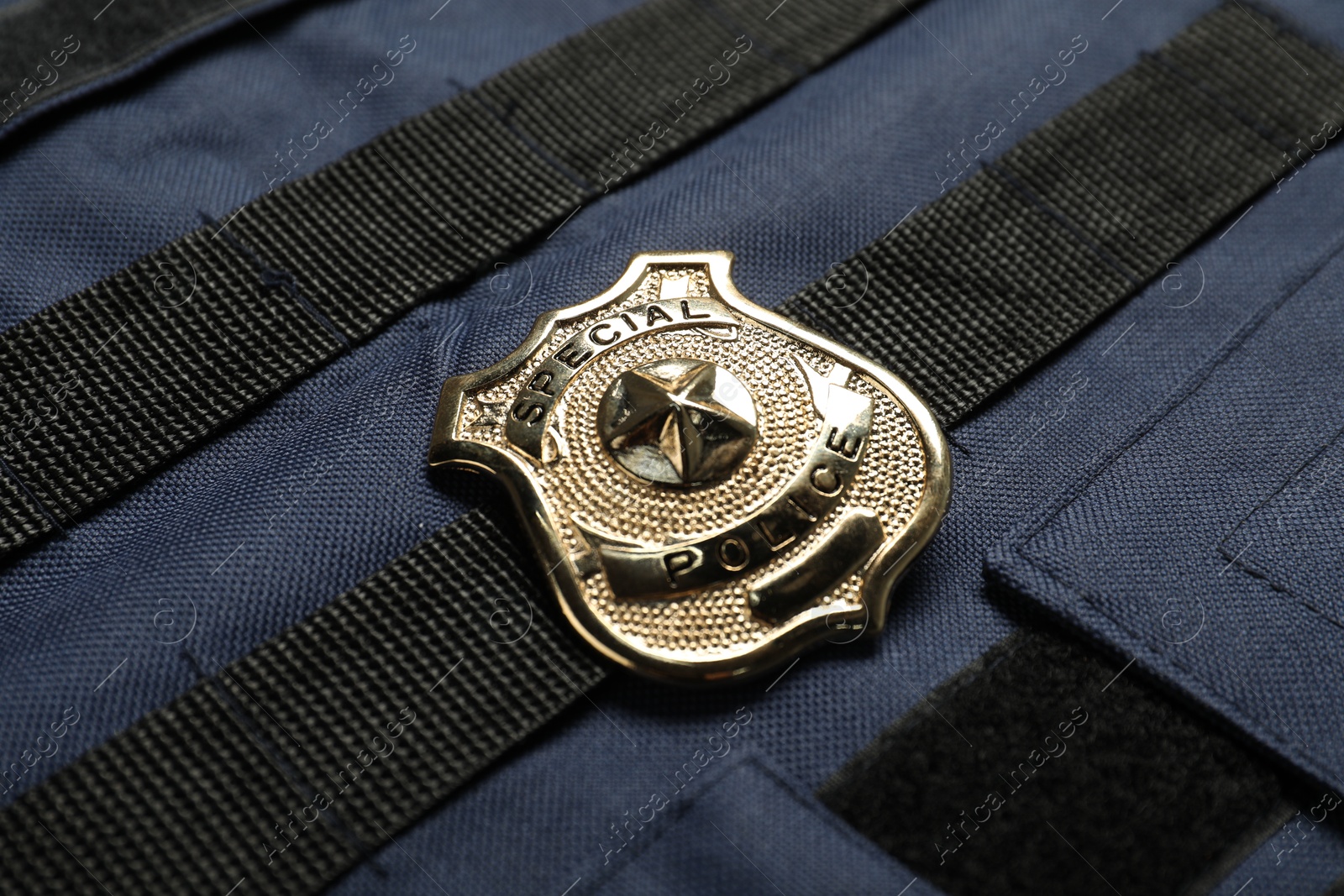 Police badge on bulletproof vest, above view Photo of Police badge on bulletproof vest, above view