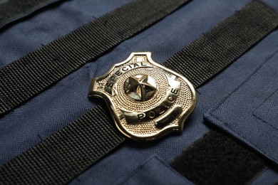 Photo of Police badge on bulletproof vest, above view