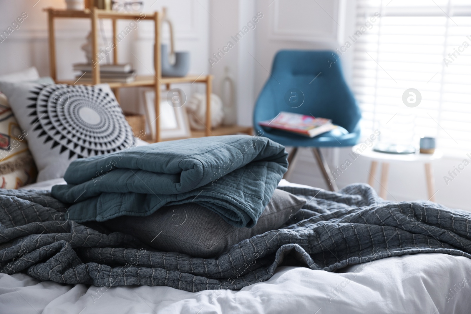 Fresh linens on bed indoors. Home textile Photo of Fresh linens on bed indoors. Home textile