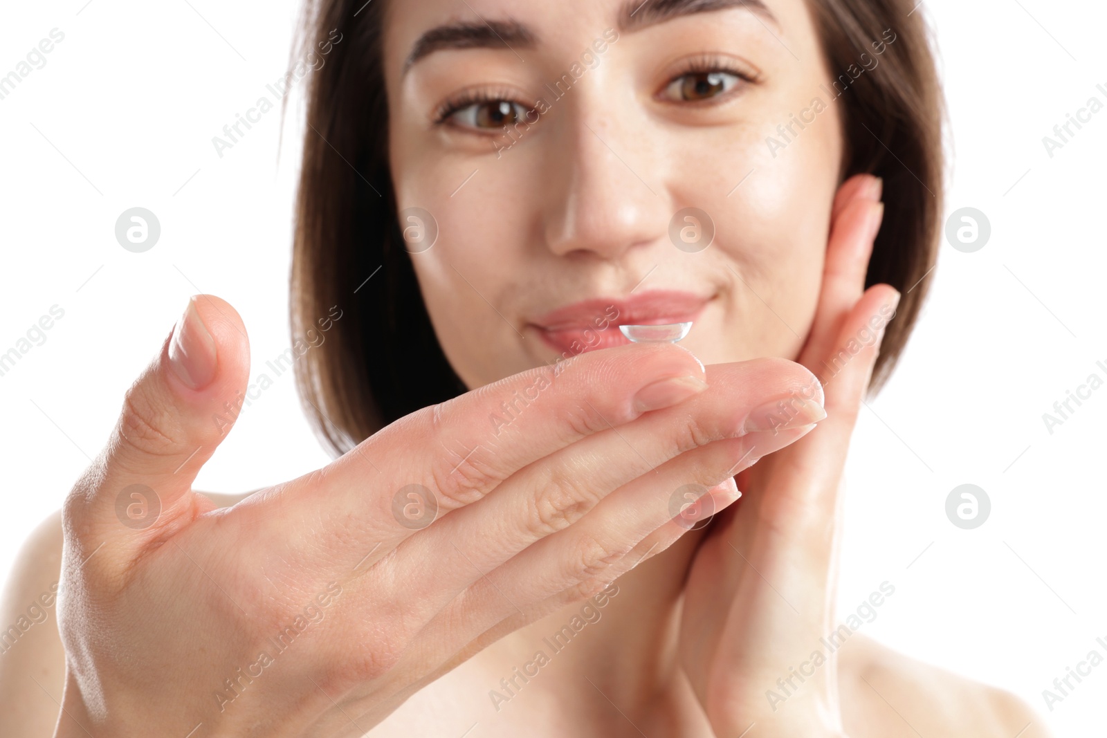 Woman with contact lens on white background, selective focus Photo of Woman with contact lens on white background, selective focus