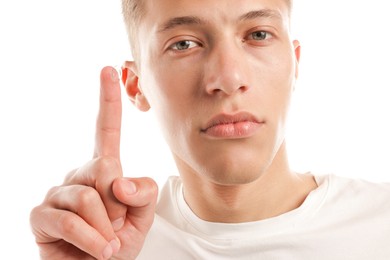 Photo of Man with contact lens on white background, closeup