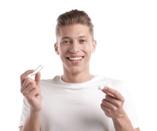 Photo of Man with contact lens and case on white background