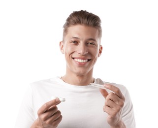 Photo of Man with contact lens and case on white background