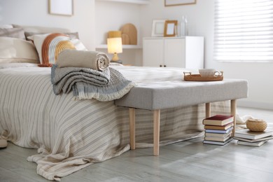 Photo of Comfortable bed with soft linens in room. Home textile