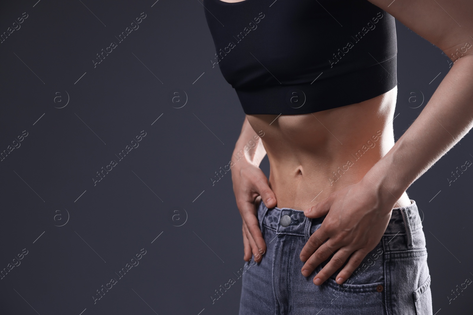 Woman suffering from anorexia on grey background, closeup. Space for text Photo of Woman suffering from anorexia on grey background, closeup. Space for text