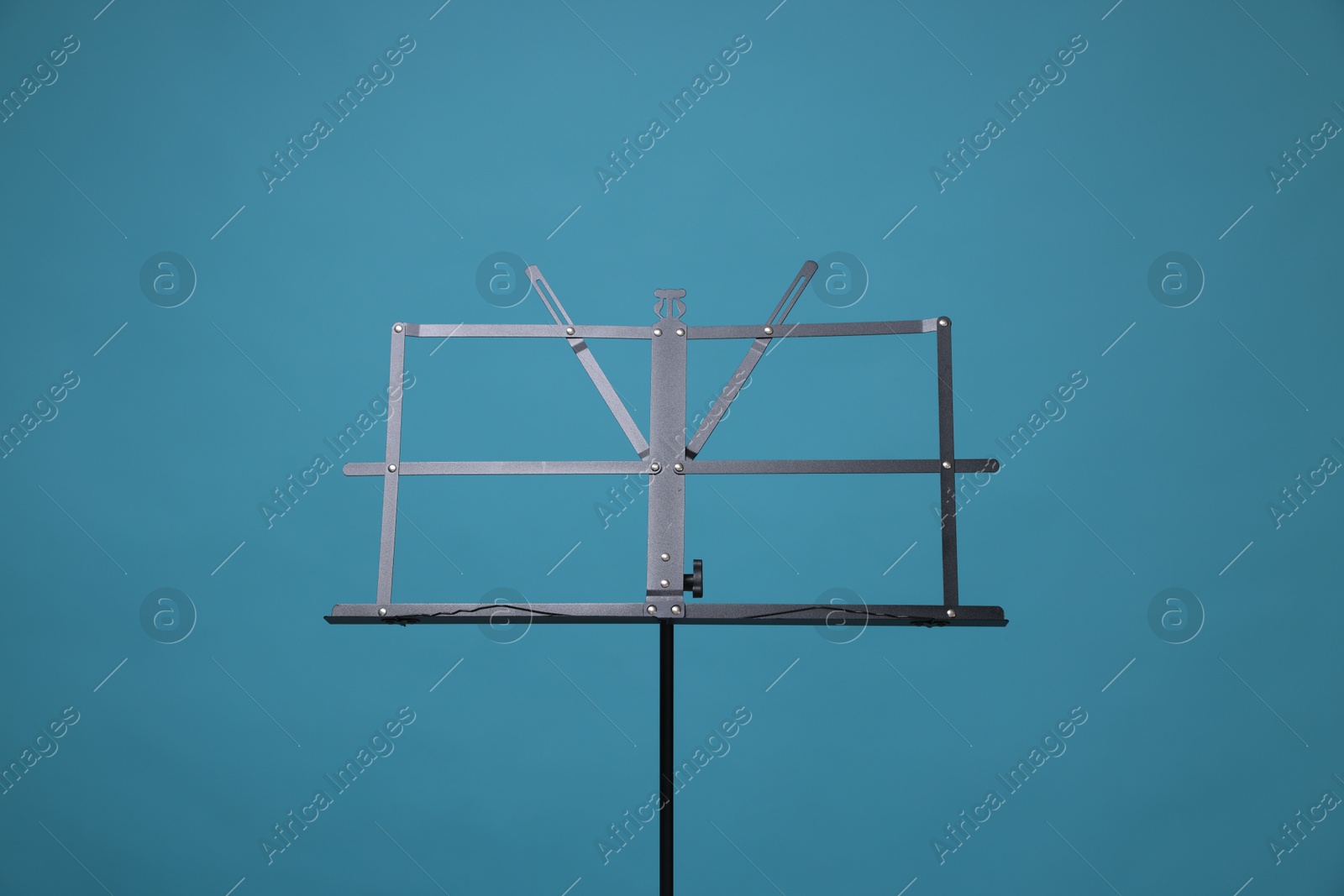 One empty note stand on light blue background Photo of One empty note stand on light blue background