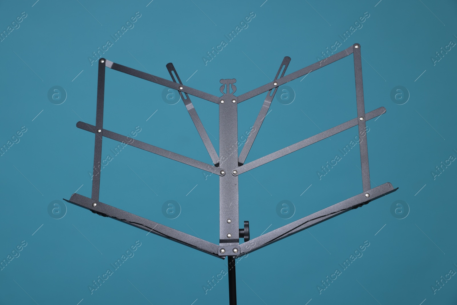 One empty note stand on light blue background Photo of One empty note stand on light blue background