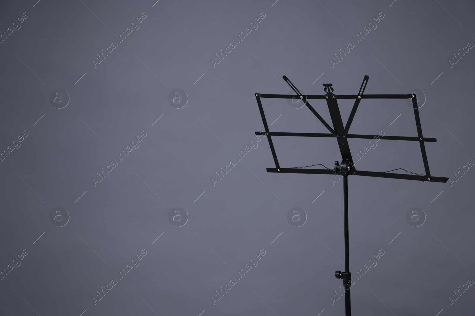 One empty note stand on grey background, space for text Photo of One empty note stand on grey background, space for text