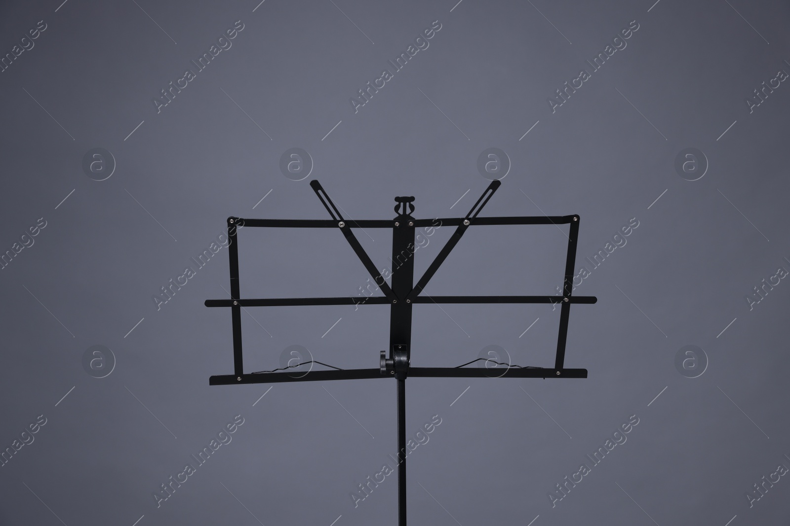One empty note stand on grey background Photo of One empty note stand on grey background