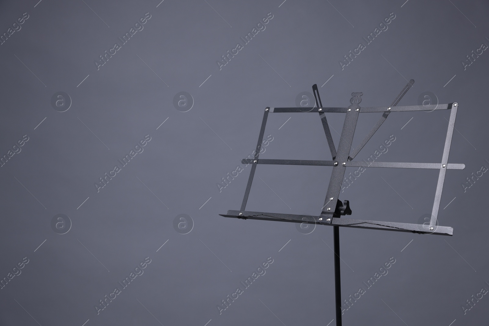 One empty note stand on grey background, space for text Photo of One empty note stand on grey background, space for text