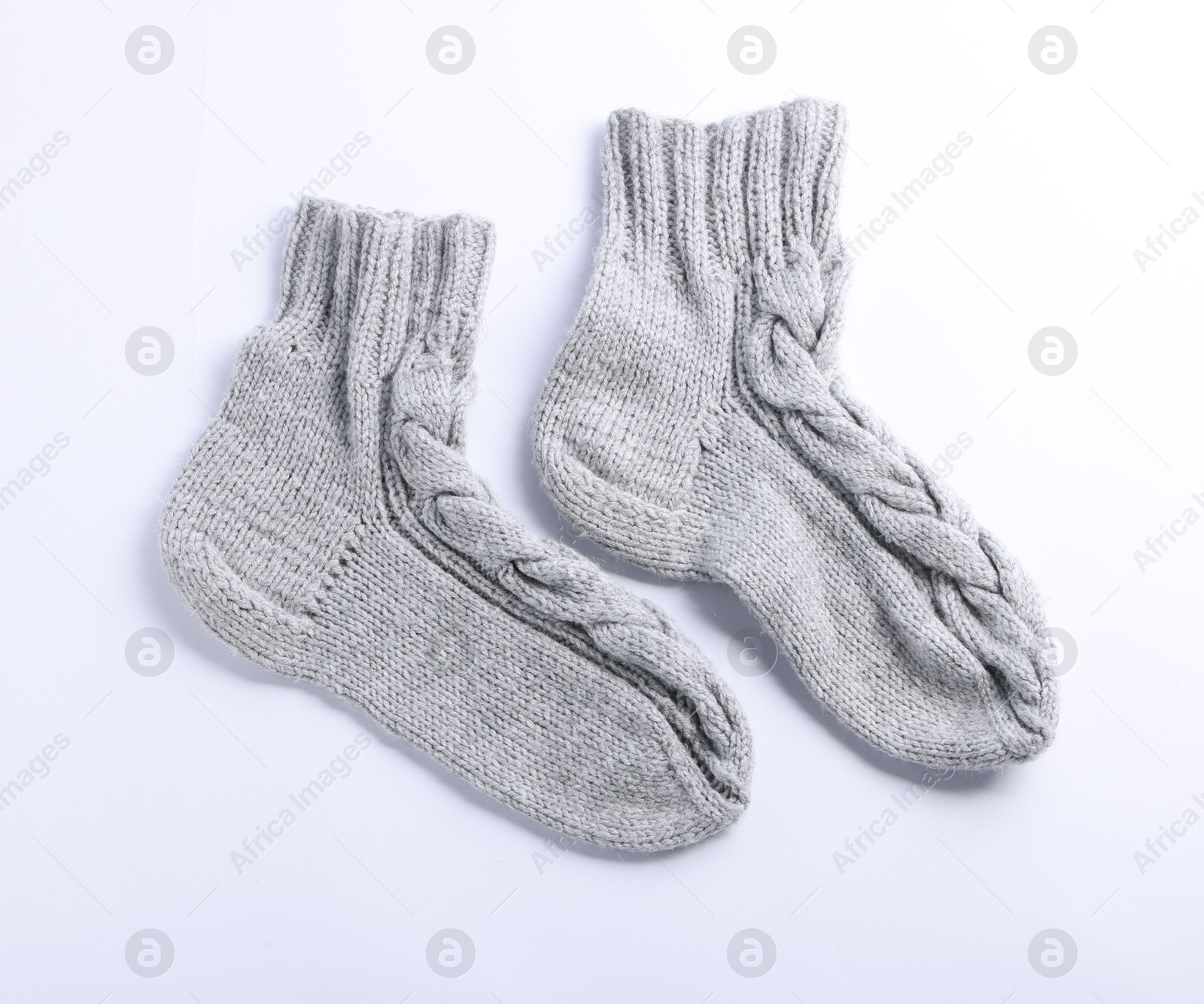 Pair of gray wool socks isolated on white, top view Photo of Pair of gray wool socks isolated on white, top view