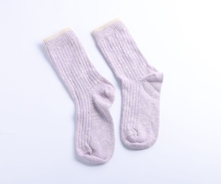 Photo of Pair of violet wool socks isolated on white, top view