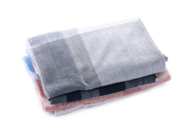 Photo of Stack of stylish wool scarves isolated on white