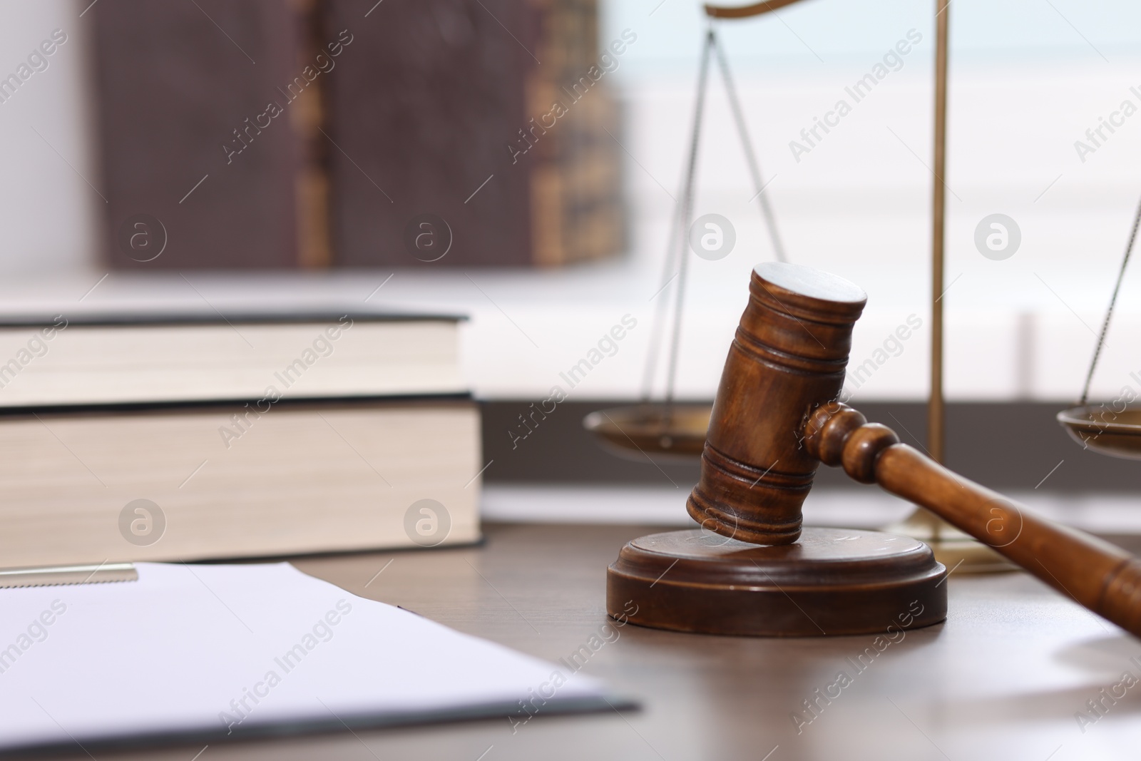 Judge. Gavel, scales, clipboard and books on wooden table in office, selective focus Photo of Judge. Gavel, scales, clipboard and books on wooden table in office, selective focus