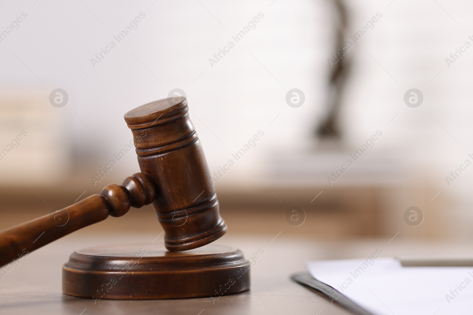 Judge. Gavel and clipboard on wooden table in office, closeup. Space for text Photo of Judge. Gavel and clipboard on wooden table in office, closeup. Space for text