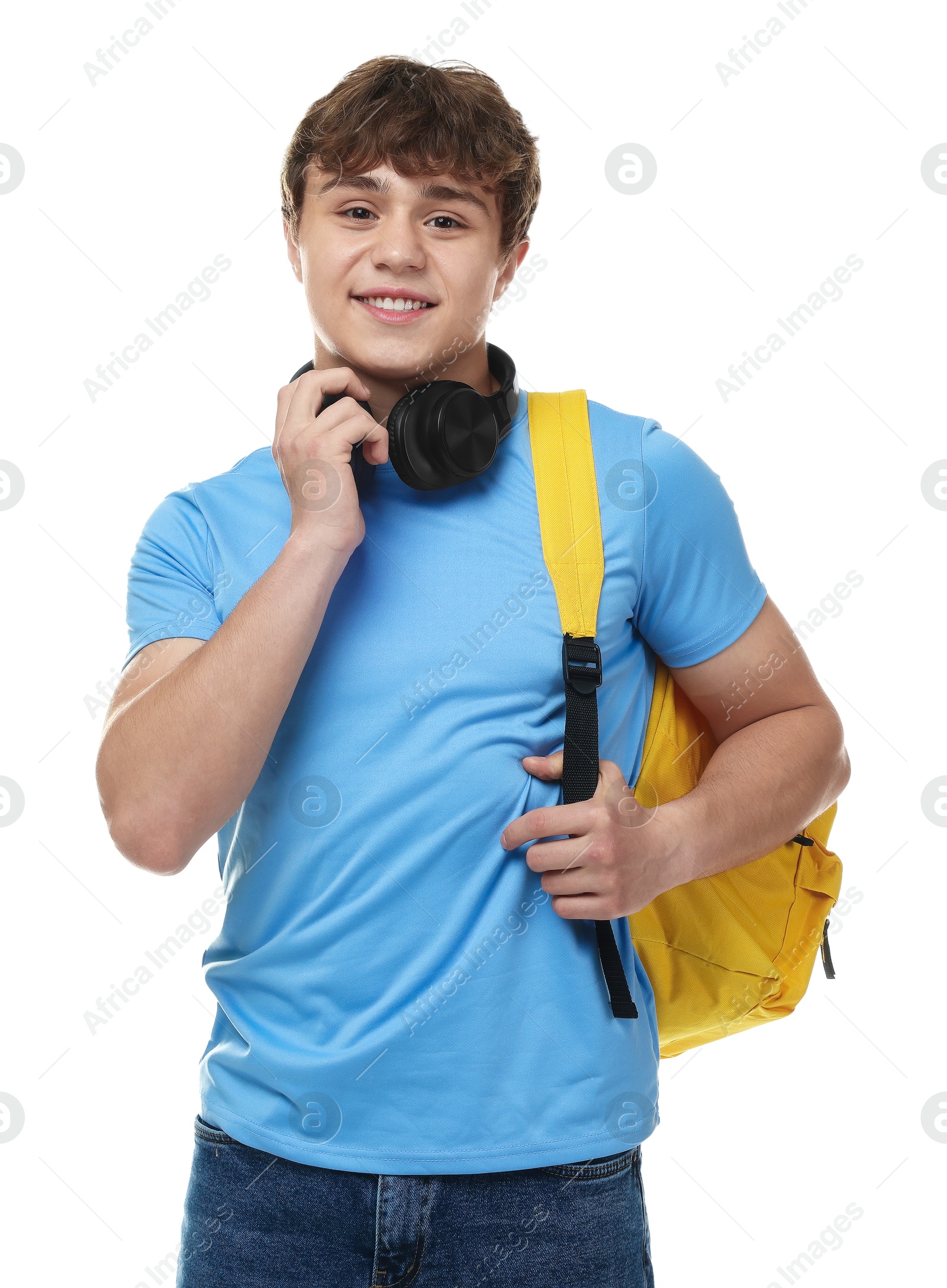 Teenage boy with headphones and backpack on white background Photo of Teenage boy with headphones and backpack on white background