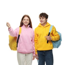 Photo of Teenage girl showing her friend something on white background