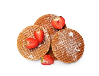 Photo of Tasty Dutch waffles (stroopwafels) and strawberries isolated on white, top view