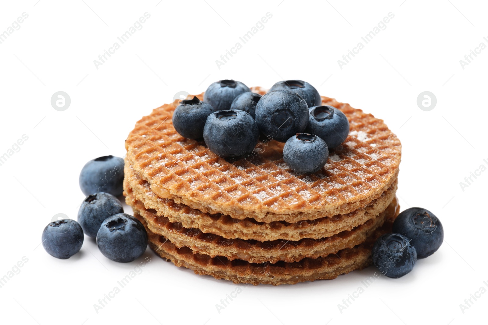 Tasty Dutch waffles (stroopwafels) and blueberries isolated on white Photo of Tasty Dutch waffles (stroopwafels) and blueberries isolated on white