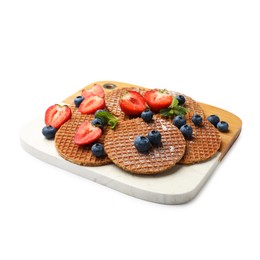 Photo of Tasty Dutch waffles (stroopwafels) and berries isolated on white