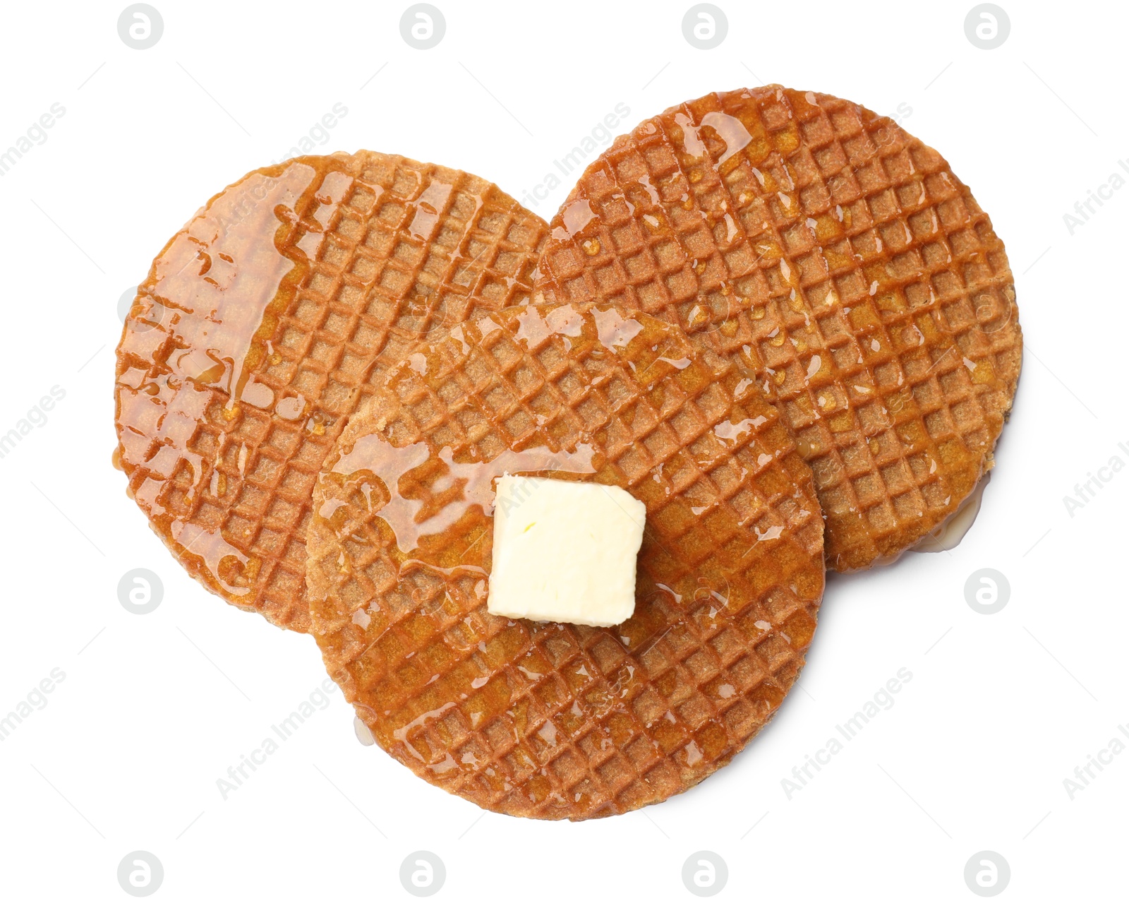 Tasty Dutch waffles (stroopwafels) with honey and butter cube isolated on white, top view Photo of Tasty Dutch waffles (stroopwafels) with honey and butter cube isolated on white, top view