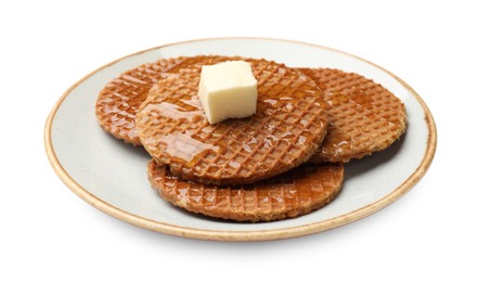 Photo of Tasty Dutch waffles (stroopwafels) with honey and butter cube isolated on white
