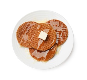 Photo of Tasty Dutch waffles (stroopwafels) with honey and butter cube isolated on white, top view