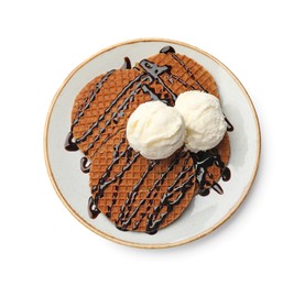 Photo of Tasty Dutch waffles (stroopwafels) with ice cream and chocolate sauce isolated on white, top view