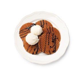 Photo of Tasty Dutch waffles (stroopwafels) with ice cream and chocolate sauce isolated on white, top view