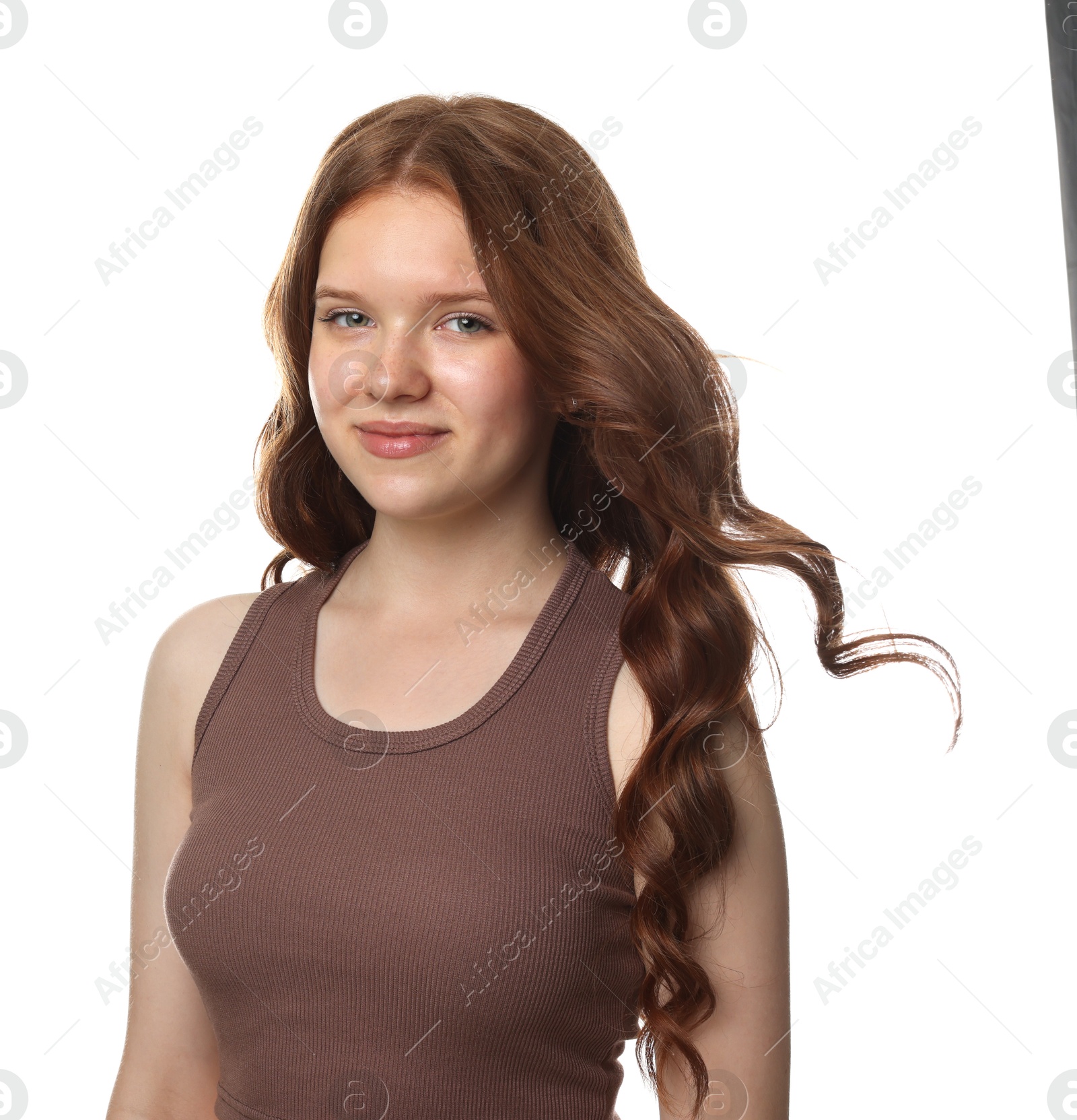 Portrait of beautiful teenage girl with healthy wavy hair on white background Photo of Portrait of beautiful teenage girl with healthy wavy hair on white background