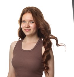 Photo of Portrait of beautiful teenage girl with healthy wavy hair on white background