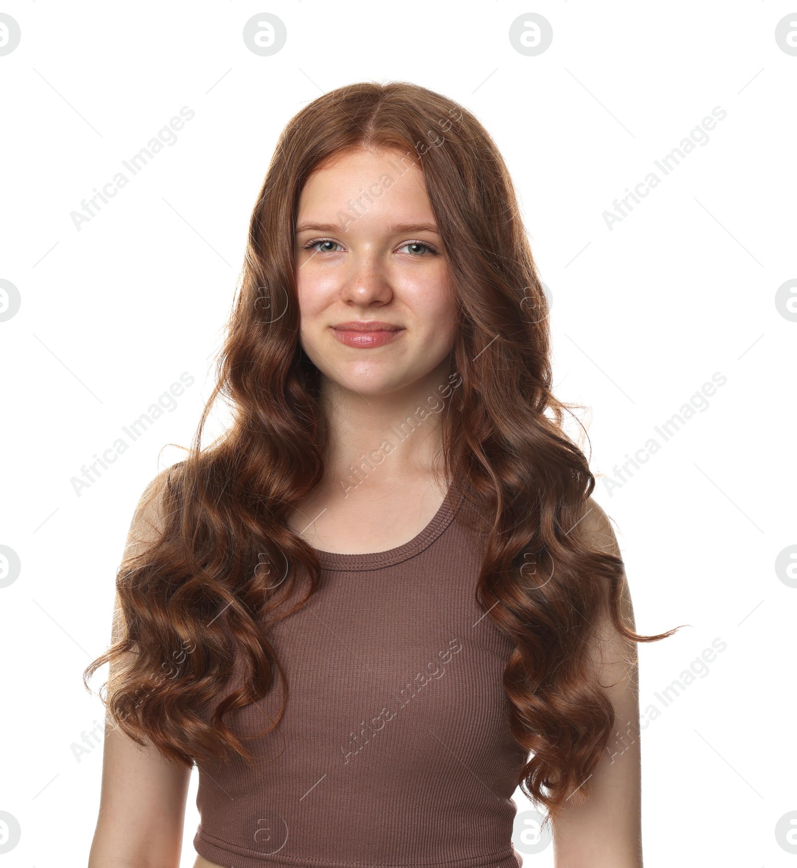 Portrait of beautiful teenage girl with healthy wavy hair on white background Photo of Portrait of beautiful teenage girl with healthy wavy hair on white background