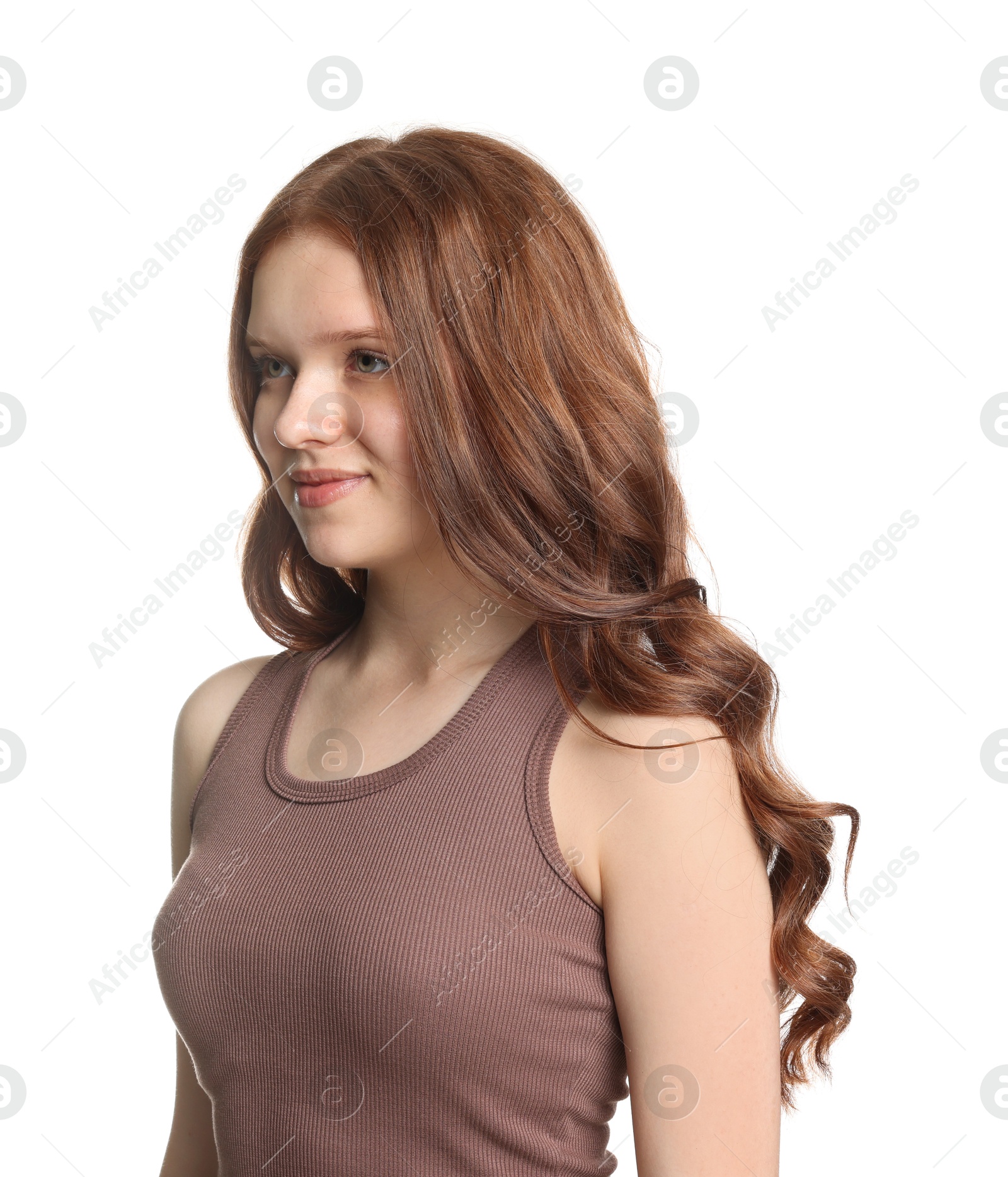 Teenage girl with healthy wavy hair on white background Photo of Teenage girl with healthy wavy hair on white background