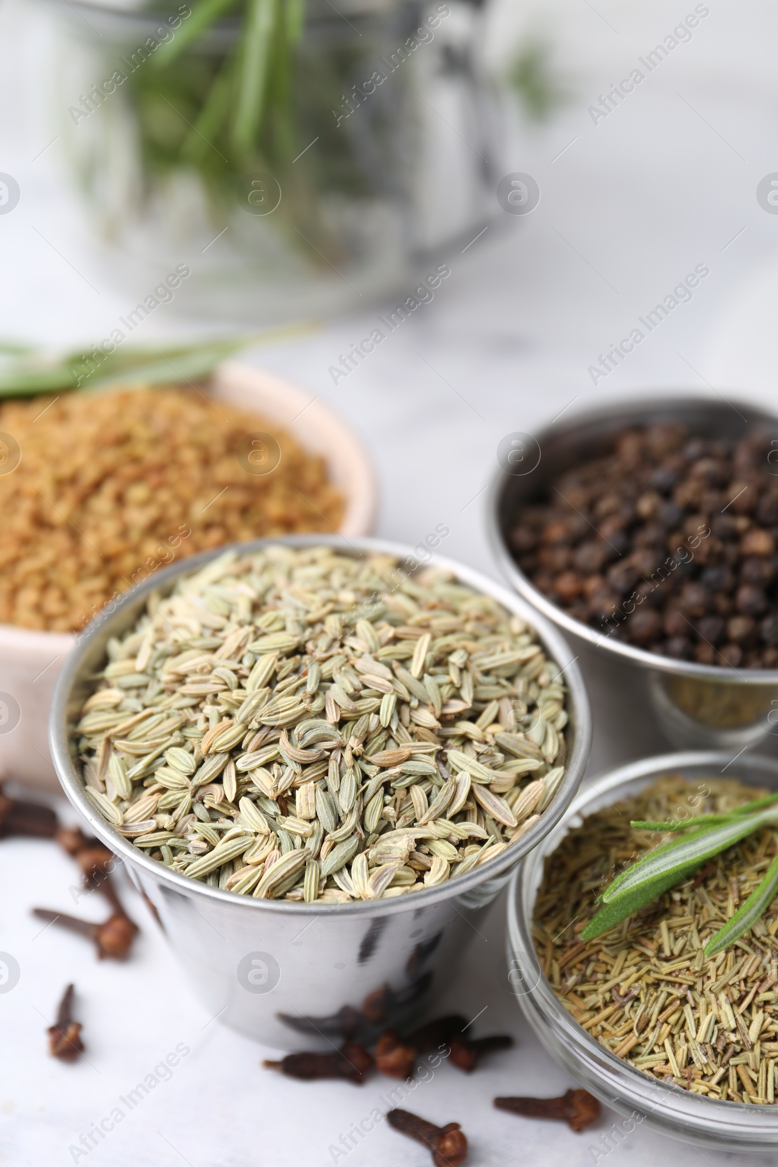 Different aromatic spices on white table, closeup Photo of Different aromatic spices on white table, closeup
