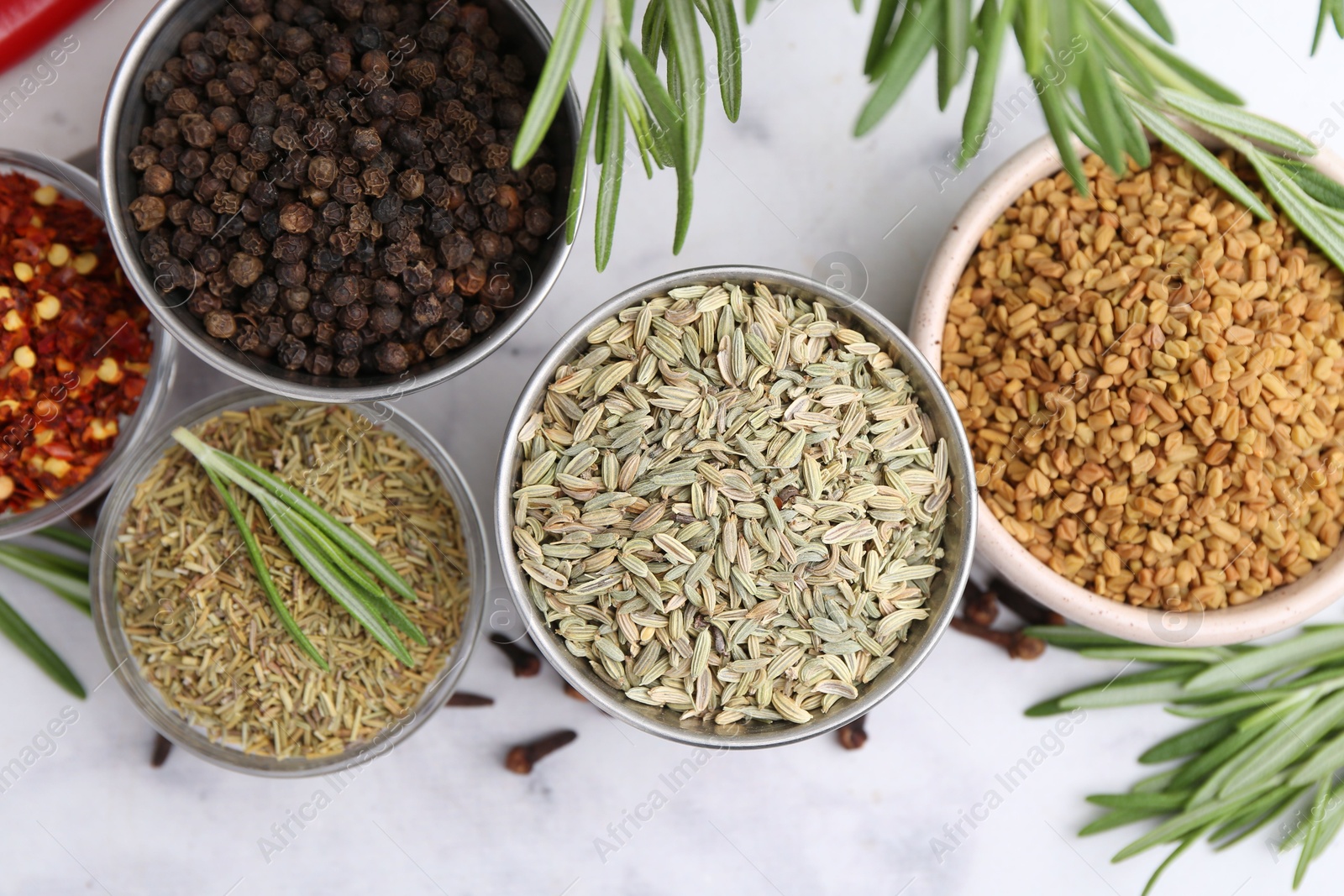 Different aromatic spices on white table, flat lay Photo of Different aromatic spices on white table, flat lay