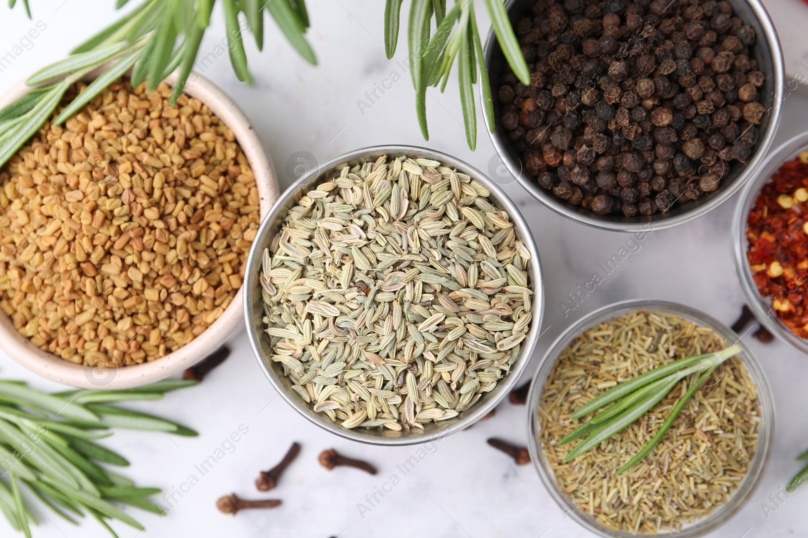 Different aromatic spices on white table, flat lay Photo of Different aromatic spices on white table, flat lay