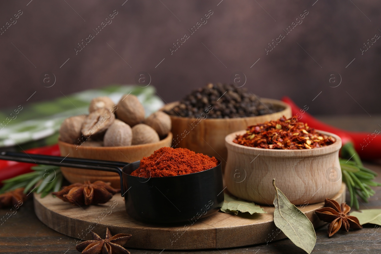 Many different aromatic spices on wooden table Photo of Many different aromatic spices on wooden table