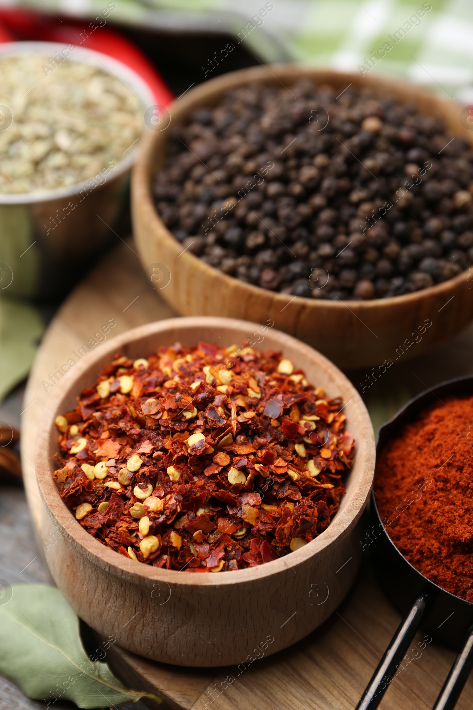 Different aromatic spices on wooden table, closeup Photo of Different aromatic spices on wooden table, closeup