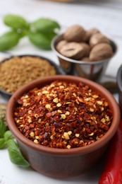 Photo of Different aromatic spices on white table, closeup