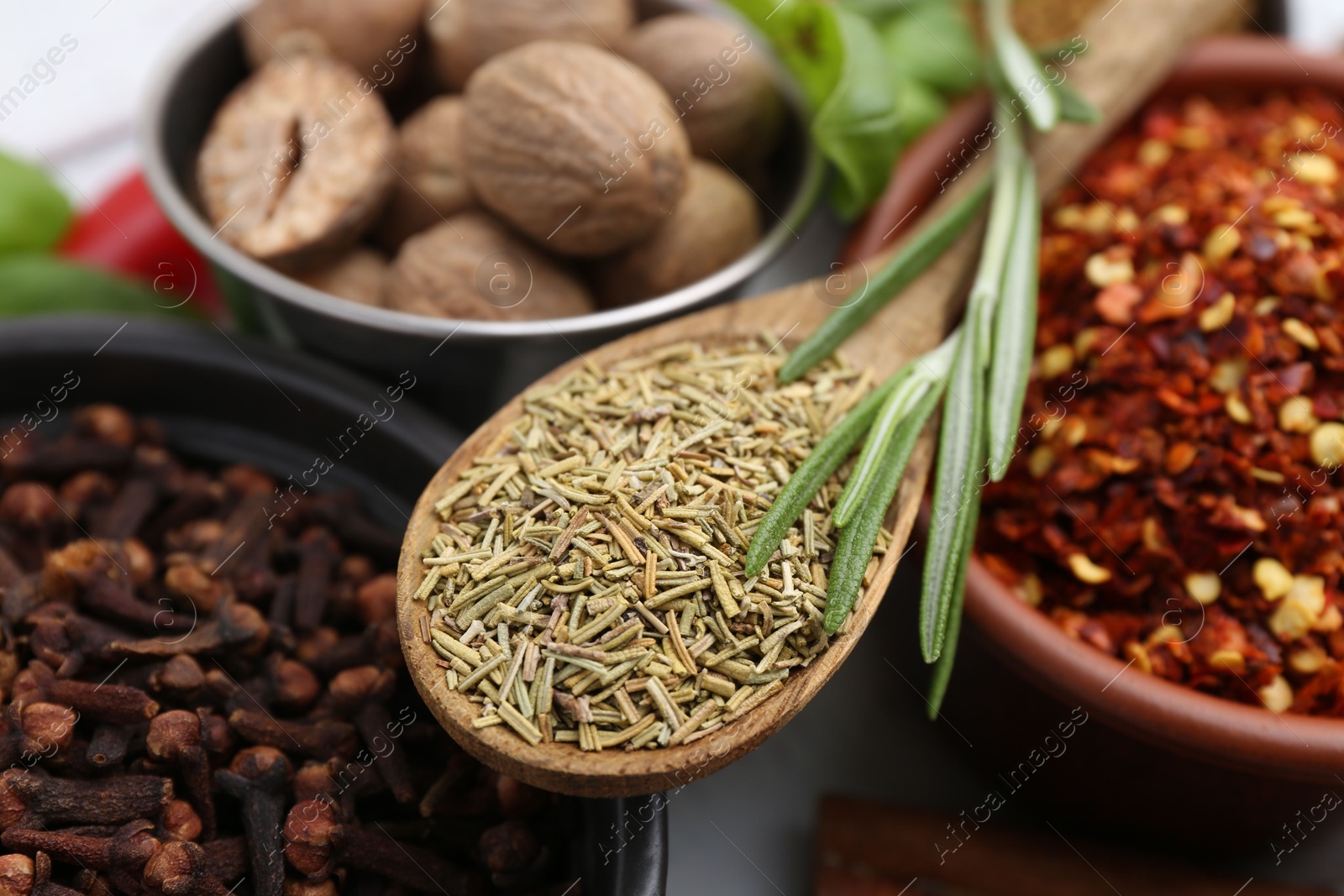 Different aromatic spices on white table, closeup Photo of Different aromatic spices on white table, closeup