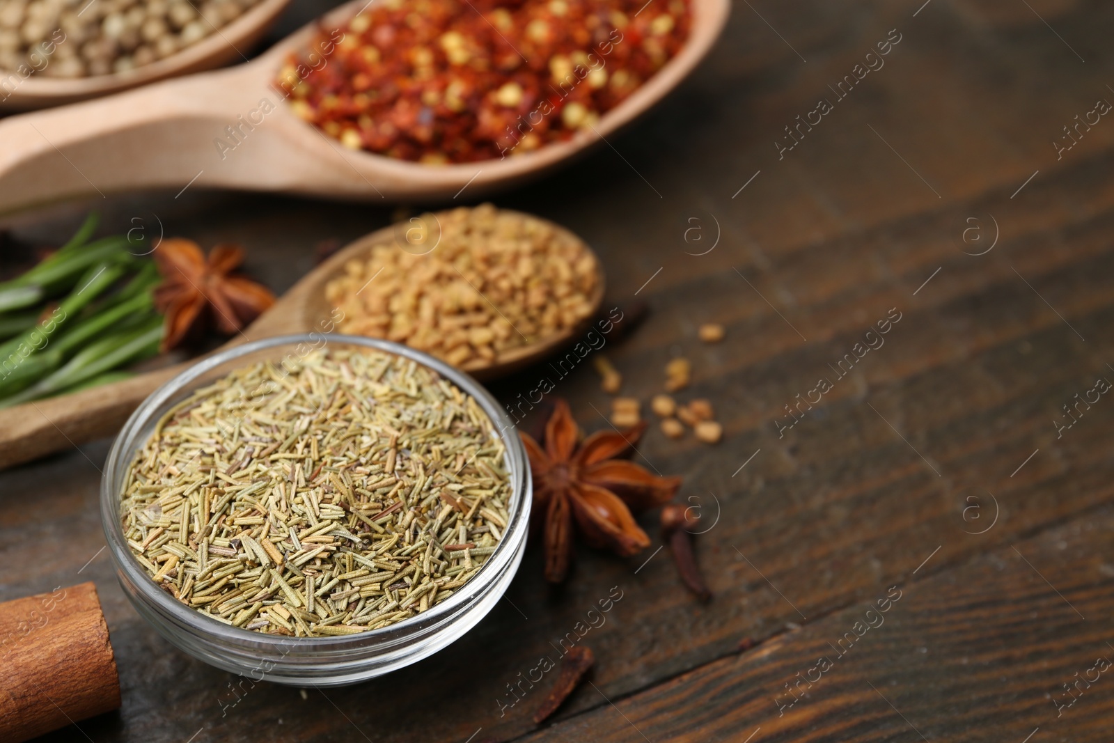 Different aromatic spices on wooden table, closeup. Space for text Photo of Different aromatic spices on wooden table, closeup. Space for text