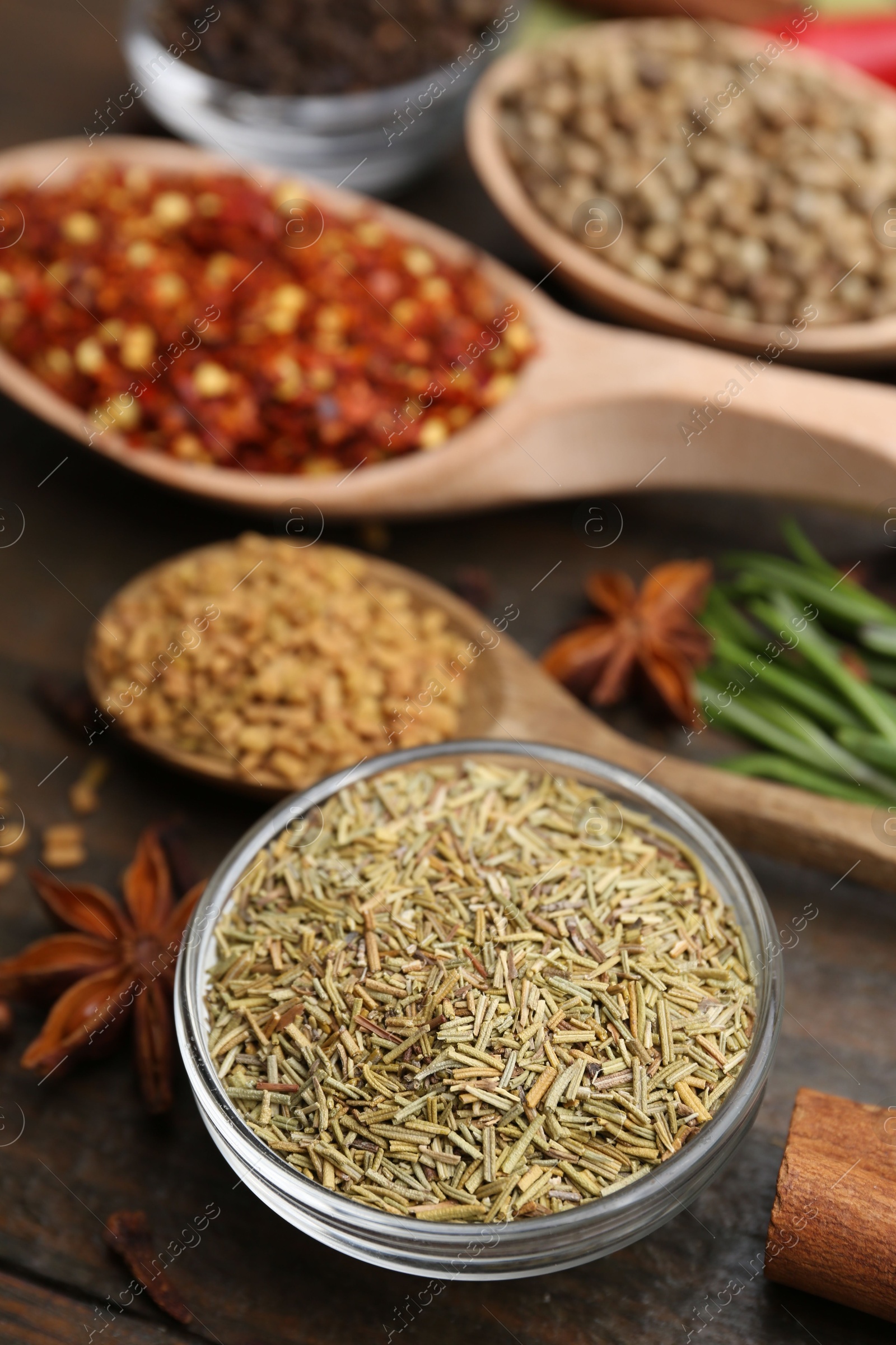 Different aromatic spices on wooden table, closeup Photo of Different aromatic spices on wooden table, closeup