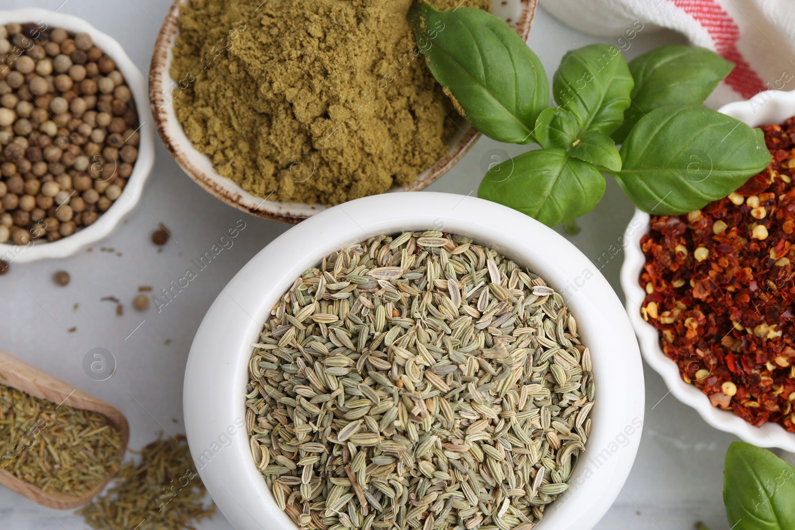 Different aromatic spices on white table, closeup Photo of Different aromatic spices on white table, closeup
