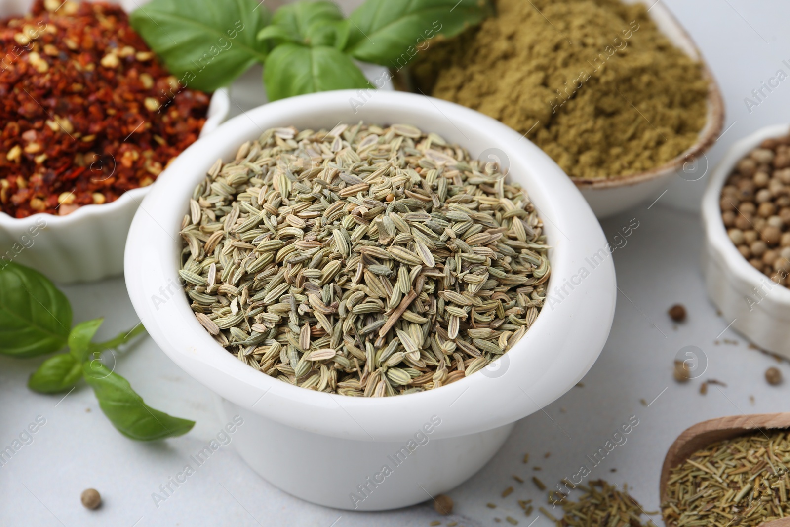 Different aromatic spices on white table, closeup Photo of Different aromatic spices on white table, closeup
