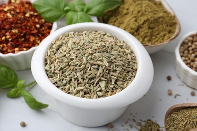 Photo of Different aromatic spices on white table, closeup