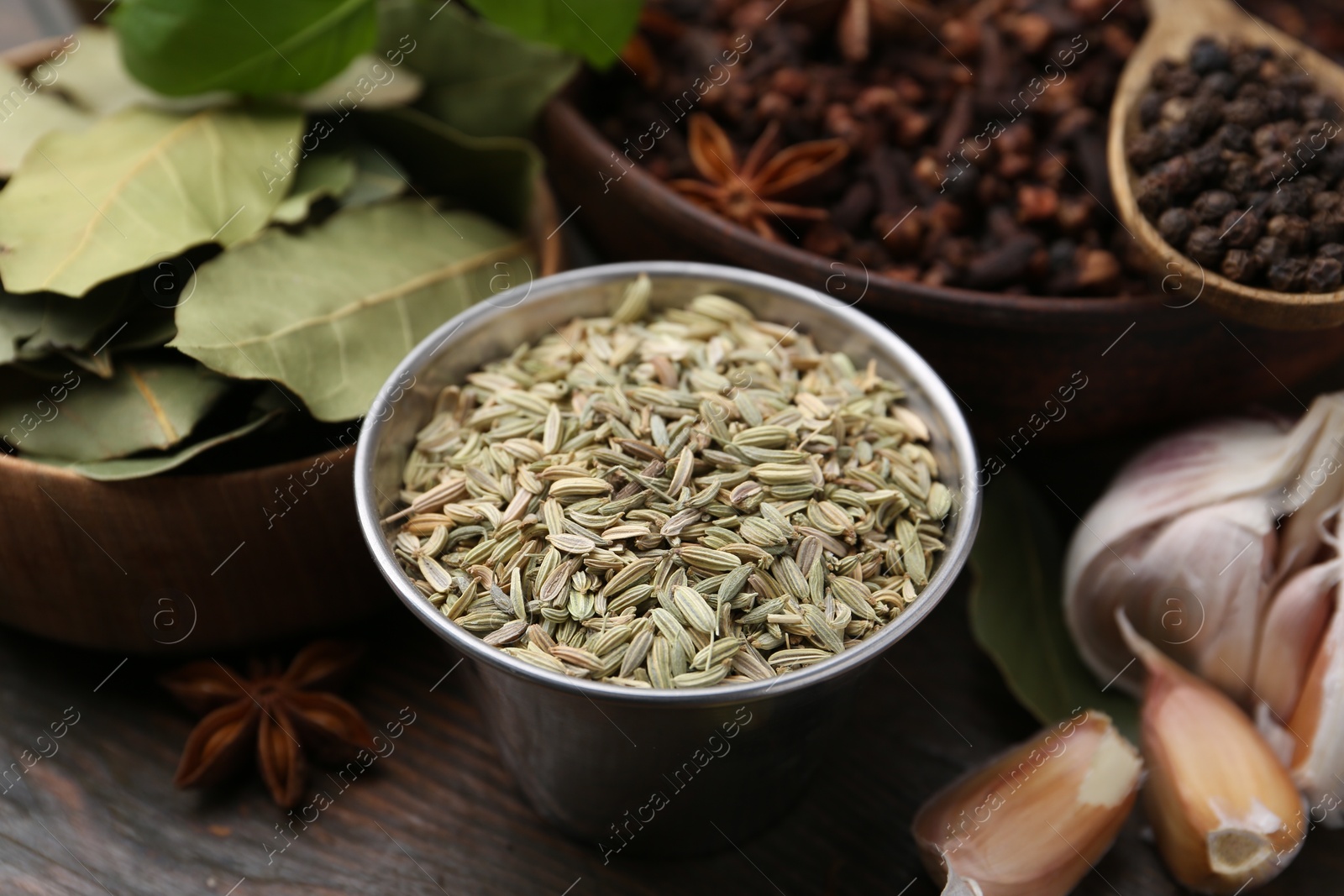 Different aromatic spices on wooden table, closeup Photo of Different aromatic spices on wooden table, closeup