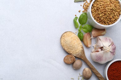 Photo of Different aromatic spices on light grey table, flat lay. Space for text