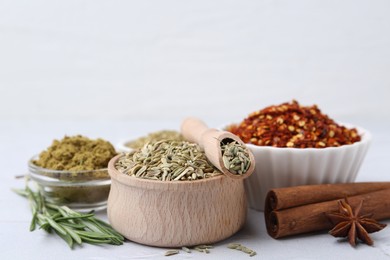 Photo of Different aromatic spices on light grey table, closeup