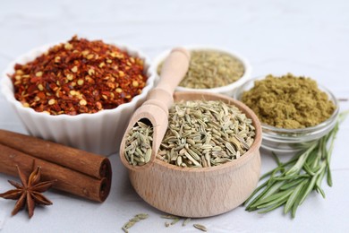 Photo of Different aromatic spices on light grey table, closeup